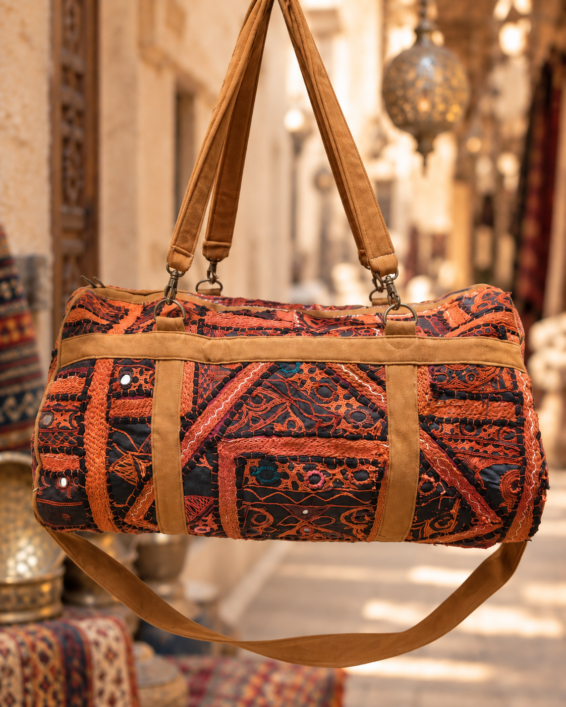 Image of Handmade Embroidered Orange & Black Handmade Duffle Bag with Mirror Detailing | Siena