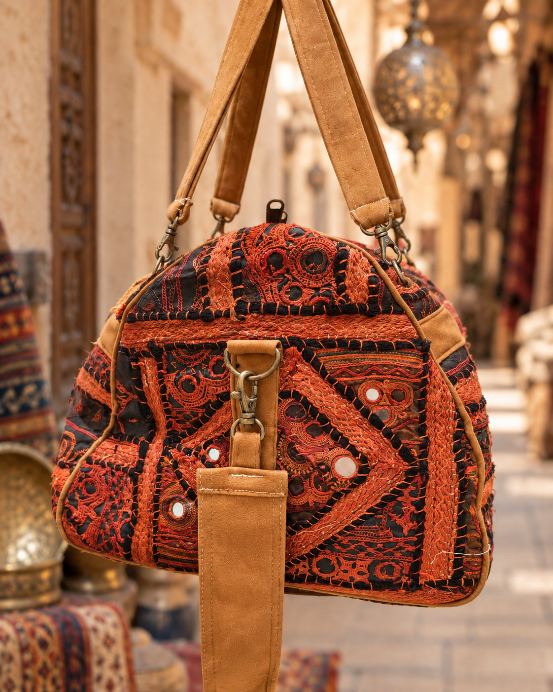 Image of Handmade Embroidered Orange & Black Handmade Duffle Bag with Mirror Detailing | Siena